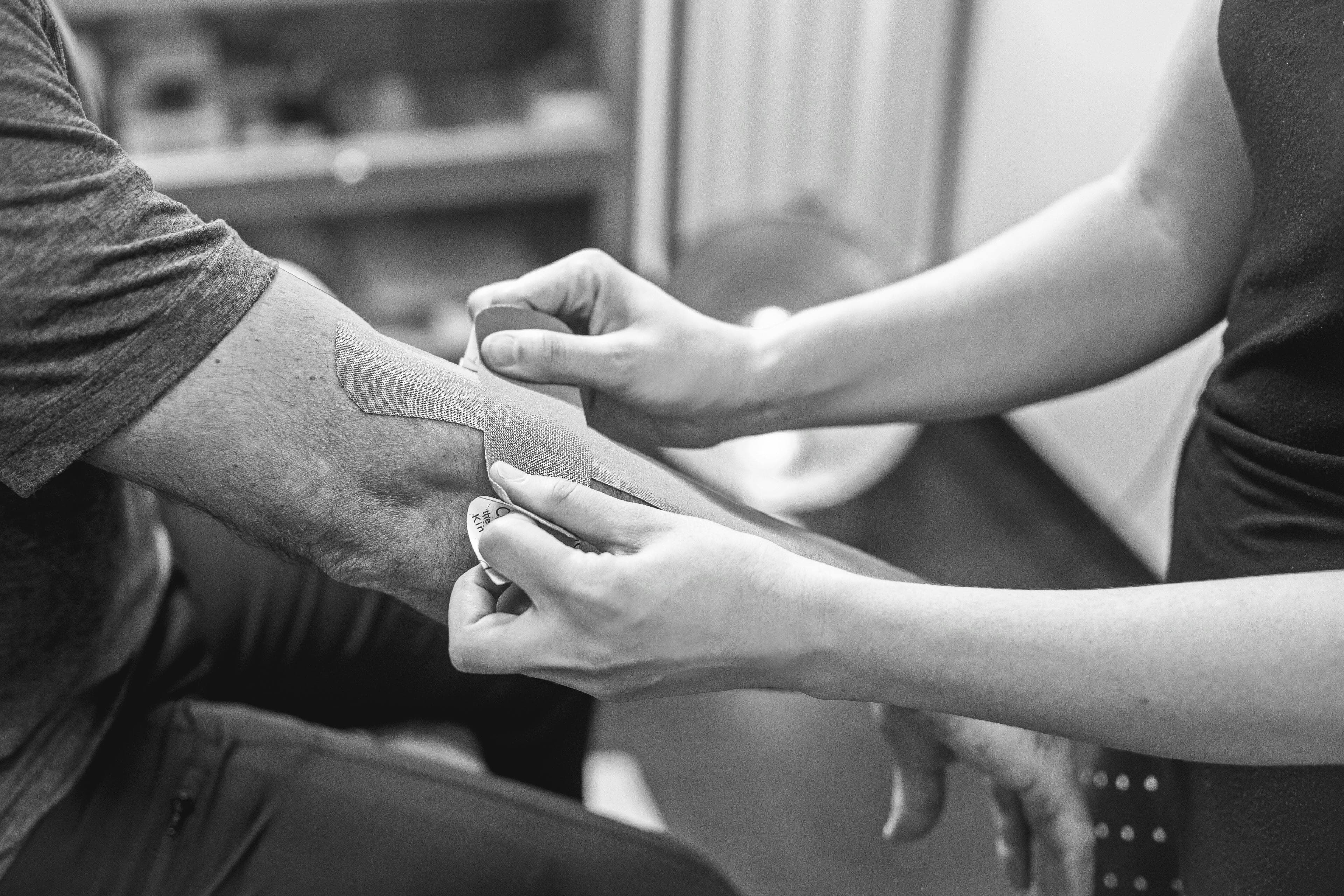 Ankle being supported with sports taping